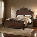 Lit queen en bois superbement sculpté, finition noyer foncé et placage