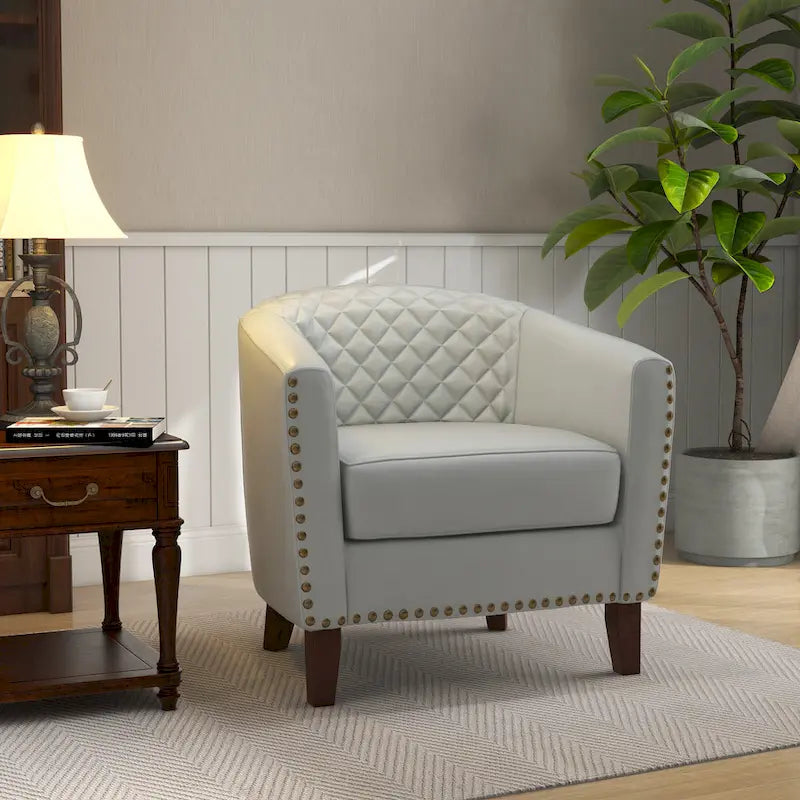 Fauteuil pivotant Ethan en cuir PU avec garniture cloutée